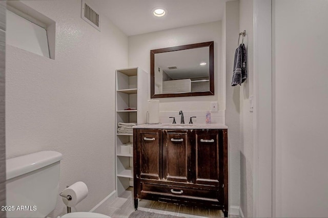 2974 N Vista Way, Payson, AZ 85541 - bathroom featuring toilet, vanity, and baseboards