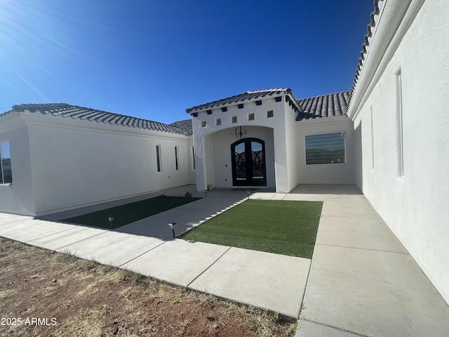 entrance to property featuring french doors