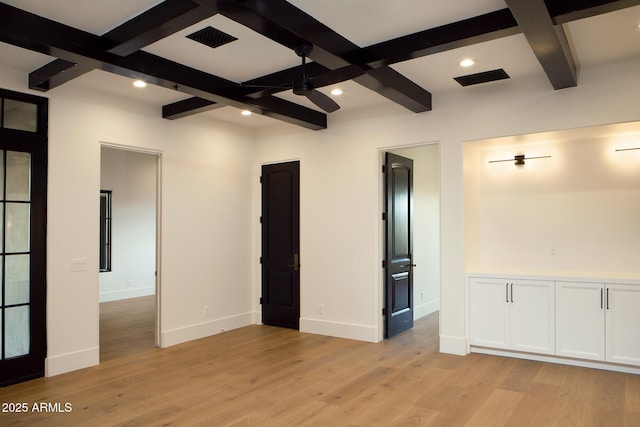 empty room featuring light wood finished floors, beam ceiling, recessed lighting, and baseboards