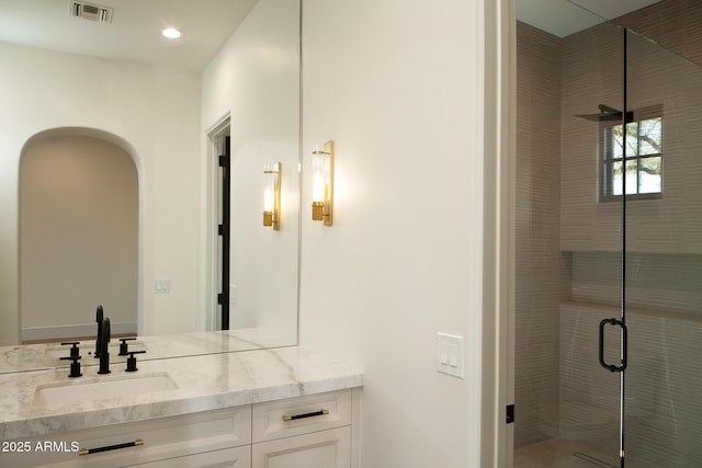 bathroom featuring recessed lighting, visible vents, a stall shower, and vanity