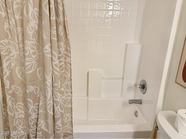 full bathroom featuring toilet and shower / bath combination with curtain