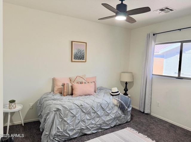 bedroom with visible vents, carpet flooring, baseboards, and ceiling fan