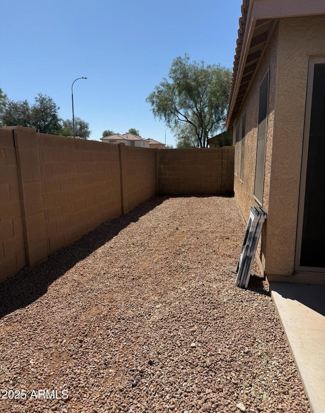 view of yard with a fenced backyard
