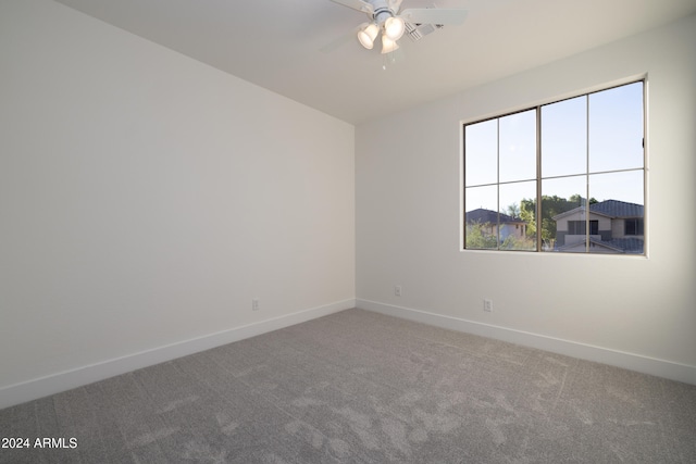 empty room with ceiling fan and carpet