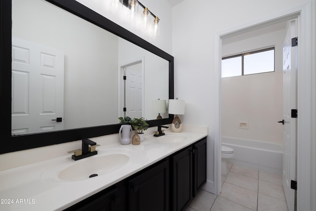 bathroom featuring toilet, vanity, and tile patterned flooring