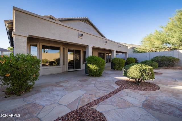 rear view of property with a patio area