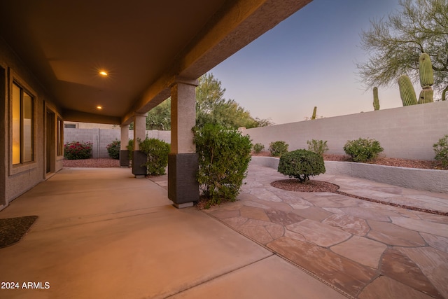 view of patio terrace at dusk