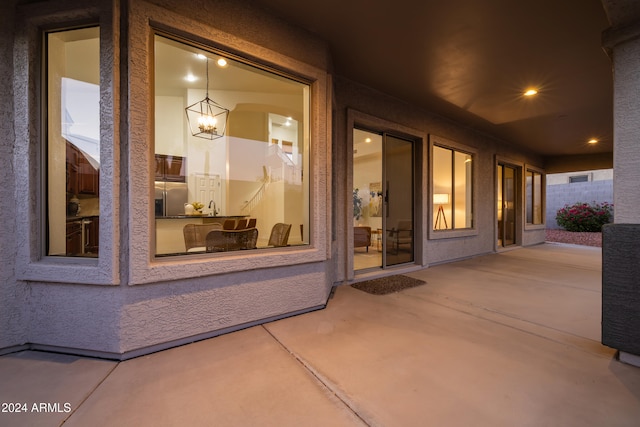 property entrance with a patio area