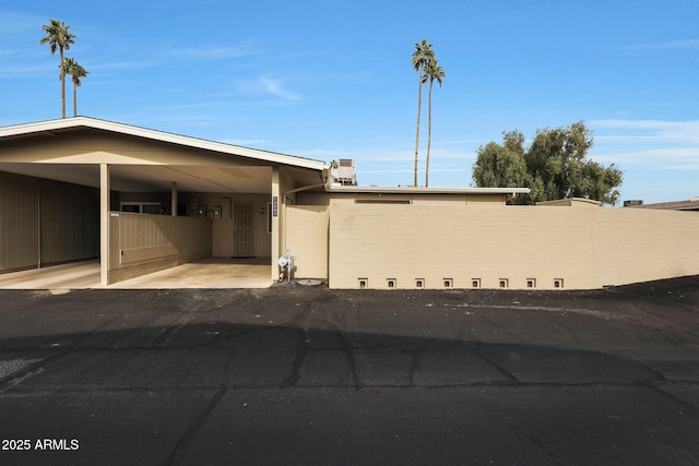 exterior space featuring a carport