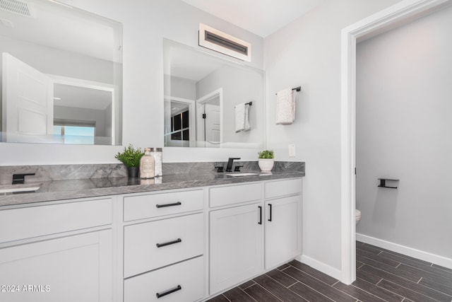 bathroom with vanity and toilet