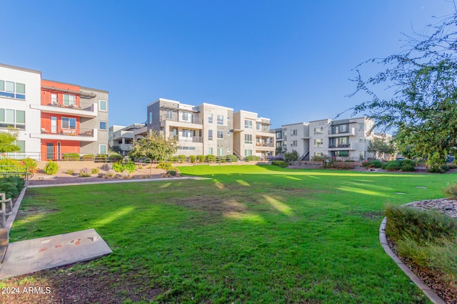 view of home's community featuring a lawn