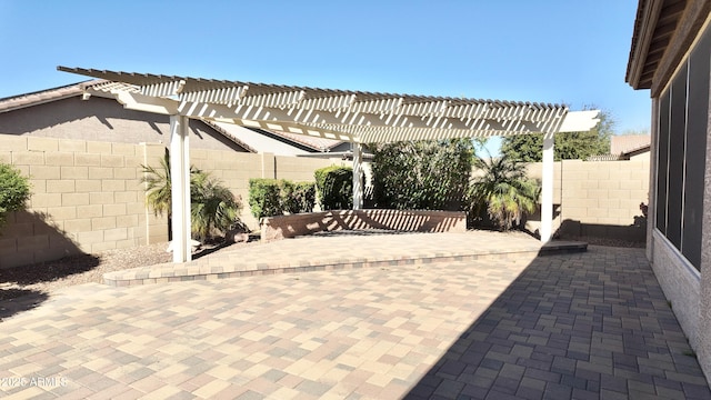 view of patio with a fenced backyard and a pergola