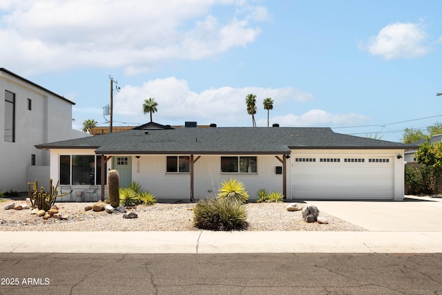 ranch-style home featuring a garage