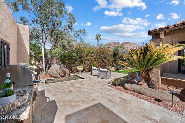 view of patio with area for grilling