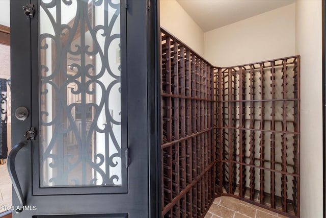 wine area featuring stone finish floor