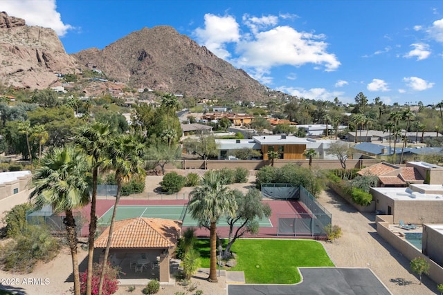 exterior space with a residential view and a mountain view