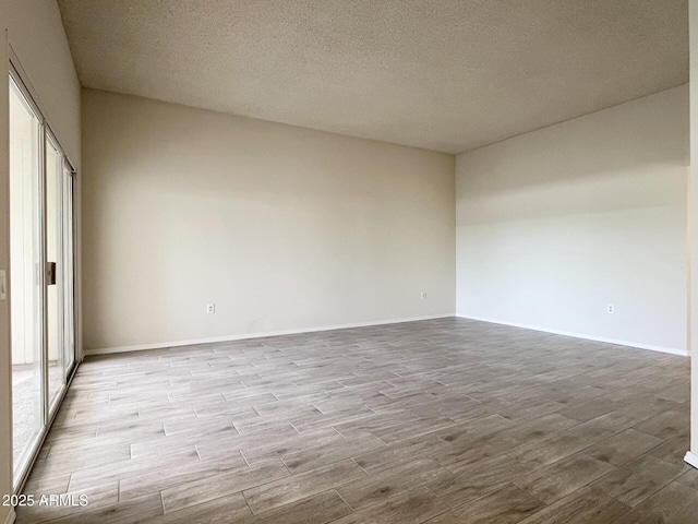 empty room with a textured ceiling