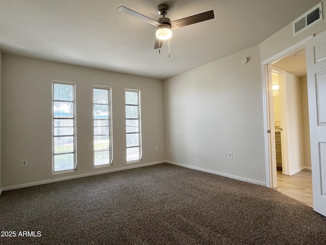 carpeted empty room with ceiling fan