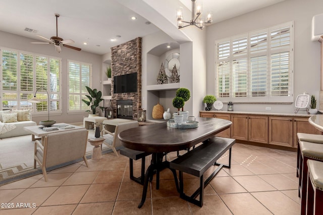 3654 E San Pedro Pl, Chandler, AZ 85249 - dining space with light tile patterned flooring, a fireplace, built in shelves, a chandelier, and recessed lighting