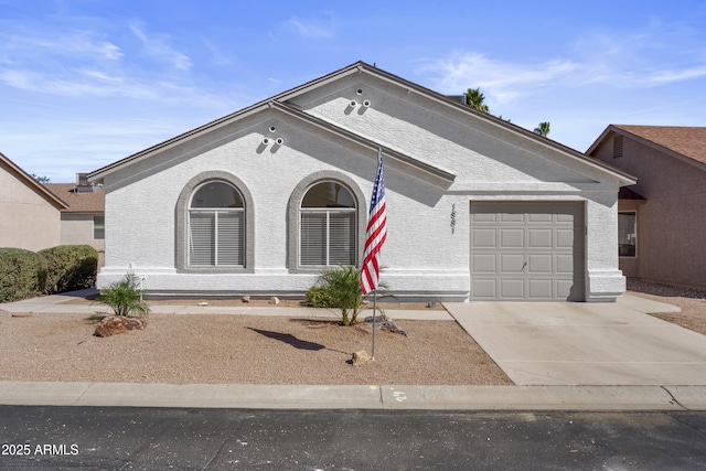 1881 E Kerby Farms Rd, Chandler, AZ 85249 - view of front of home featuring concrete driveway, a garage, and stucco siding