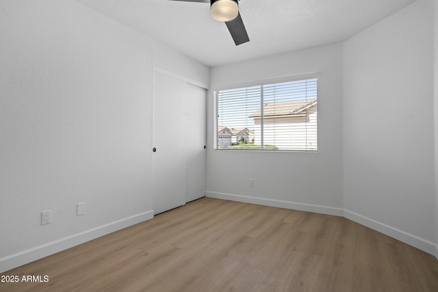 1881 E Kerby Farms Rd, Chandler, AZ 85249 - empty room with ceiling fan and light wood-style floors