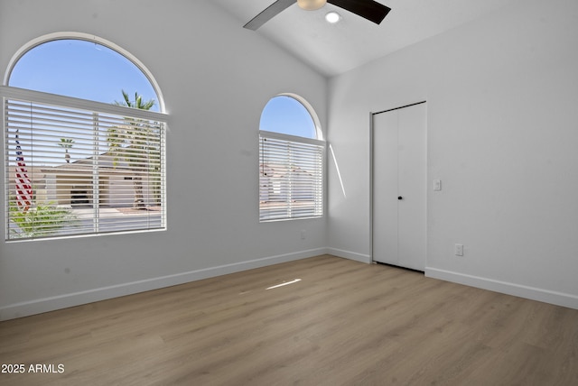 1881 E Kerby Farms Rd, Chandler, AZ 85249 - unfurnished bedroom featuring light wood-style floors, vaulted ceiling, and ceiling fan