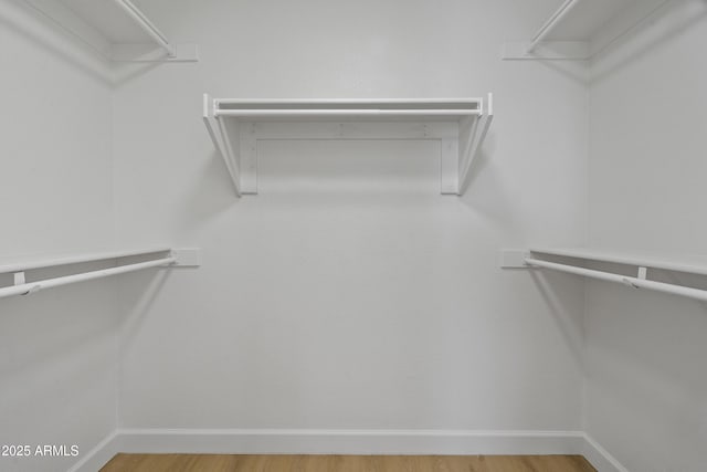 1881 E Kerby Farms Rd, Chandler, AZ 85249 - walk in closet featuring wood finished floors