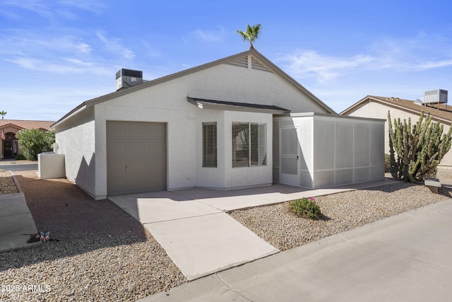 1881 E Kerby Farms Rd, Chandler, AZ 85249 - view of front of property featuring a garage, concrete driveway, stucco siding, and a chimney