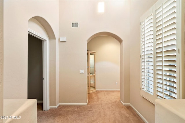 corridor with light carpet