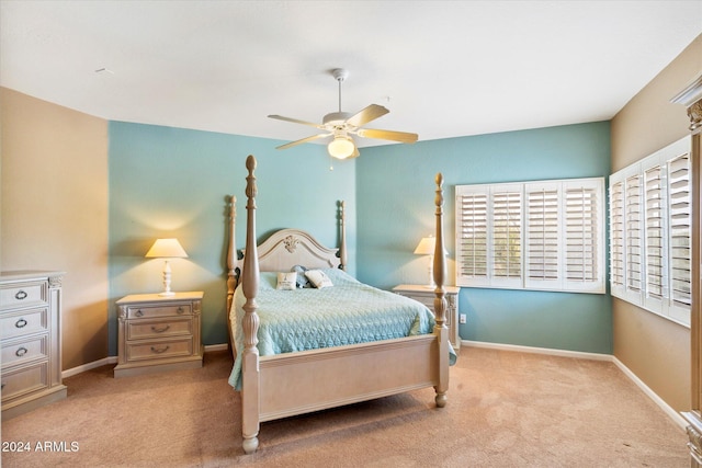 bedroom featuring light colored carpet and ceiling fan