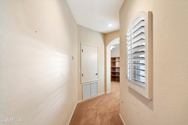 hallway with carpet flooring