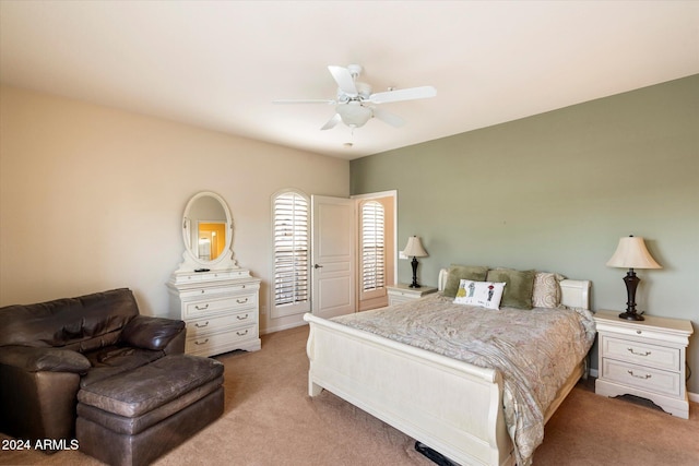 bedroom with light carpet and ceiling fan