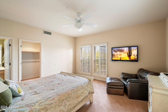 bedroom with ceiling fan and light colored carpet