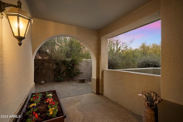 view of patio terrace at dusk