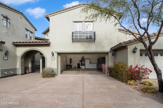 back of property featuring a balcony