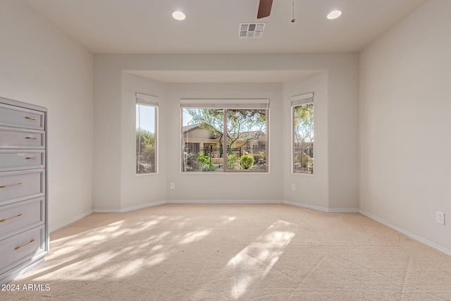 unfurnished room featuring recessed lighting, baseboards, visible vents, and light colored carpet