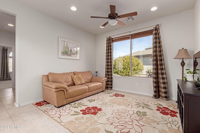 living area featuring light tile patterned floors, visible vents, a ceiling fan, and recessed lighting