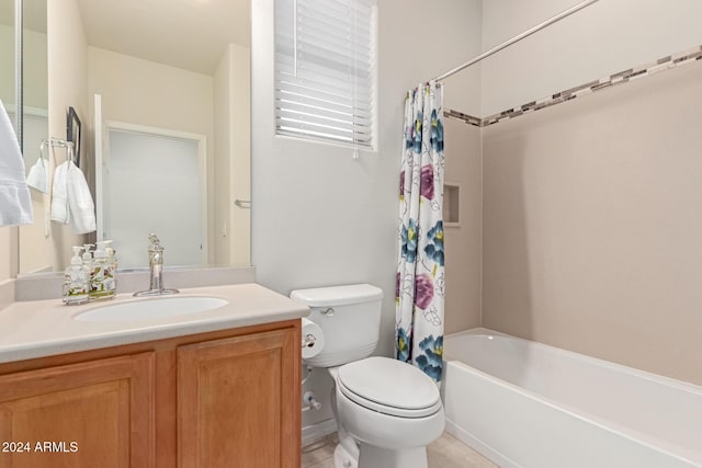 bathroom featuring shower / tub combo with curtain, vanity, and toilet