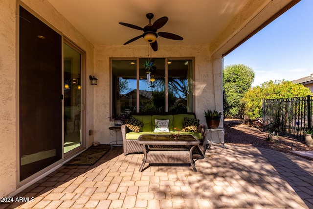 view of patio with ceiling fan, fence, and outdoor lounge area