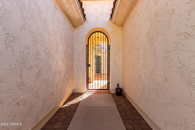 view of exterior entry with stucco siding