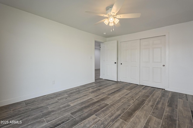 unfurnished bedroom with a closet, ceiling fan, and dark hardwood / wood-style floors