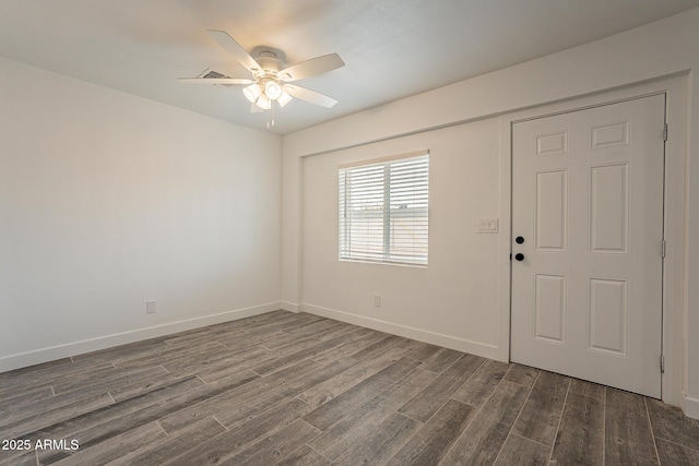 entryway featuring ceiling fan and dark hardwood / wood-style floors