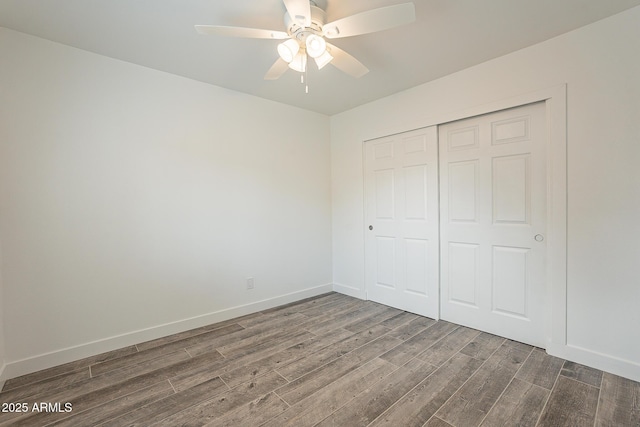 unfurnished bedroom featuring a closet, ceiling fan, and hardwood / wood-style flooring