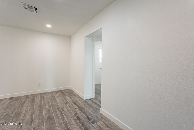 unfurnished room featuring dark hardwood / wood-style floors