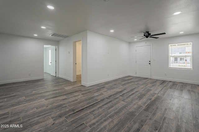 unfurnished room featuring ceiling fan and dark hardwood / wood-style flooring