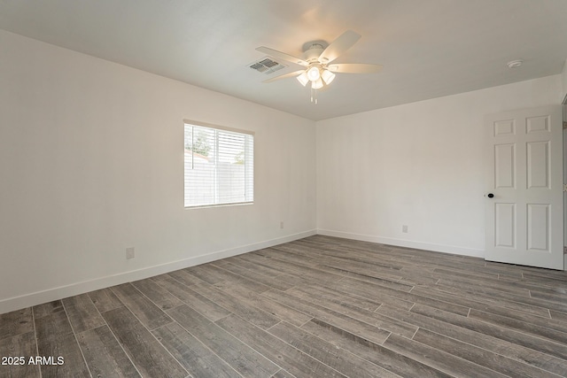 unfurnished room featuring ceiling fan and dark hardwood / wood-style floors