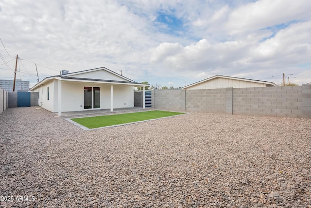 back of property with a patio area