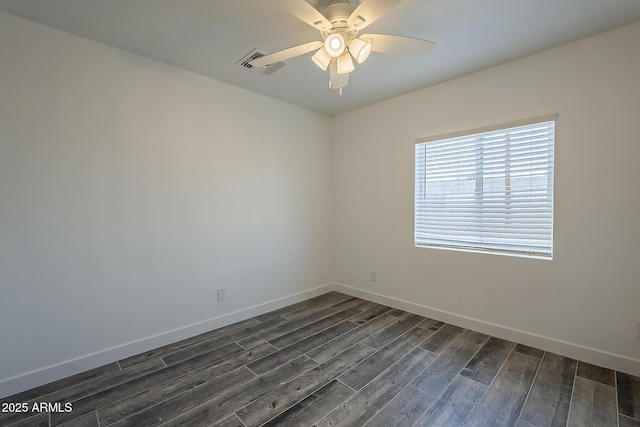 unfurnished room with ceiling fan and dark wood-type flooring