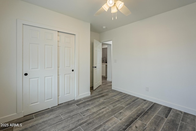 unfurnished bedroom featuring sink, a closet, and ceiling fan