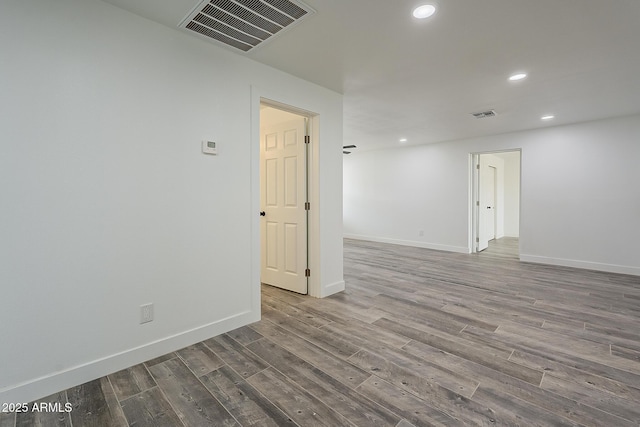 spare room featuring hardwood / wood-style flooring